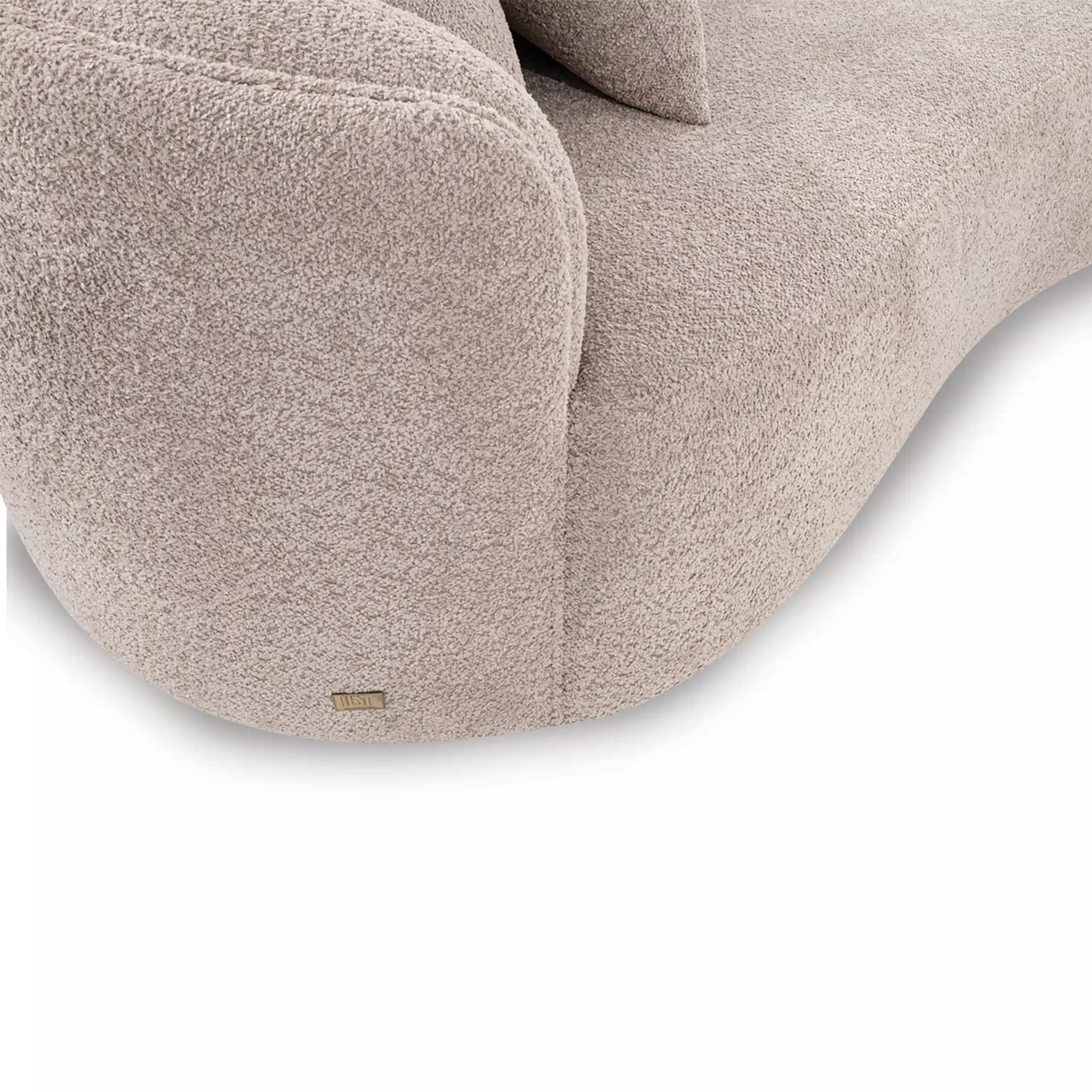 Close-up of a beige textured chair with a visible brand logo on a white background