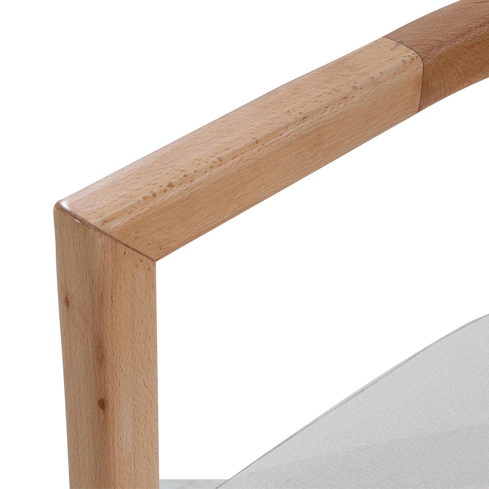 Close-up of a wooden chair leg on a white background