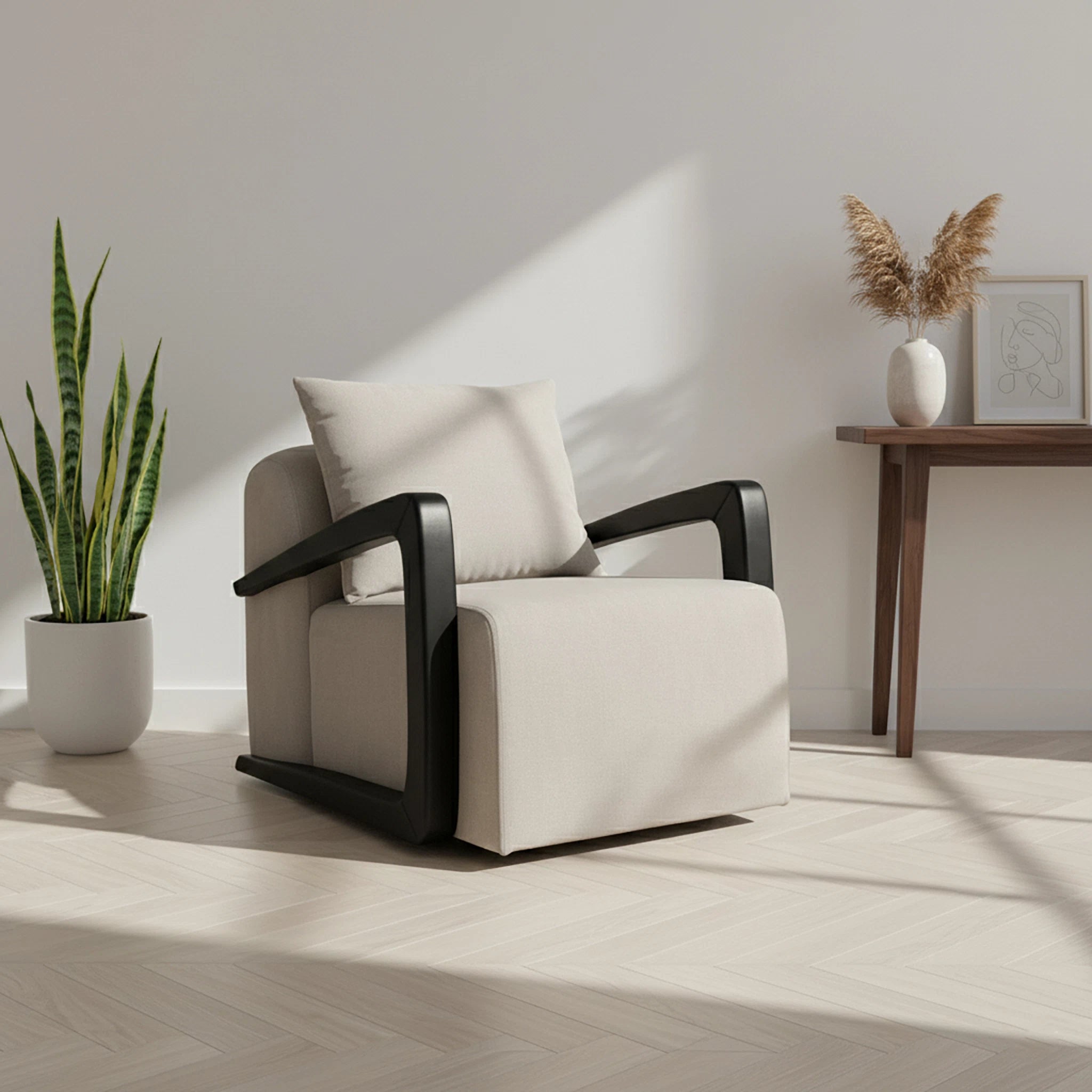 White armchair with black armrests in a room with a plant and small table.