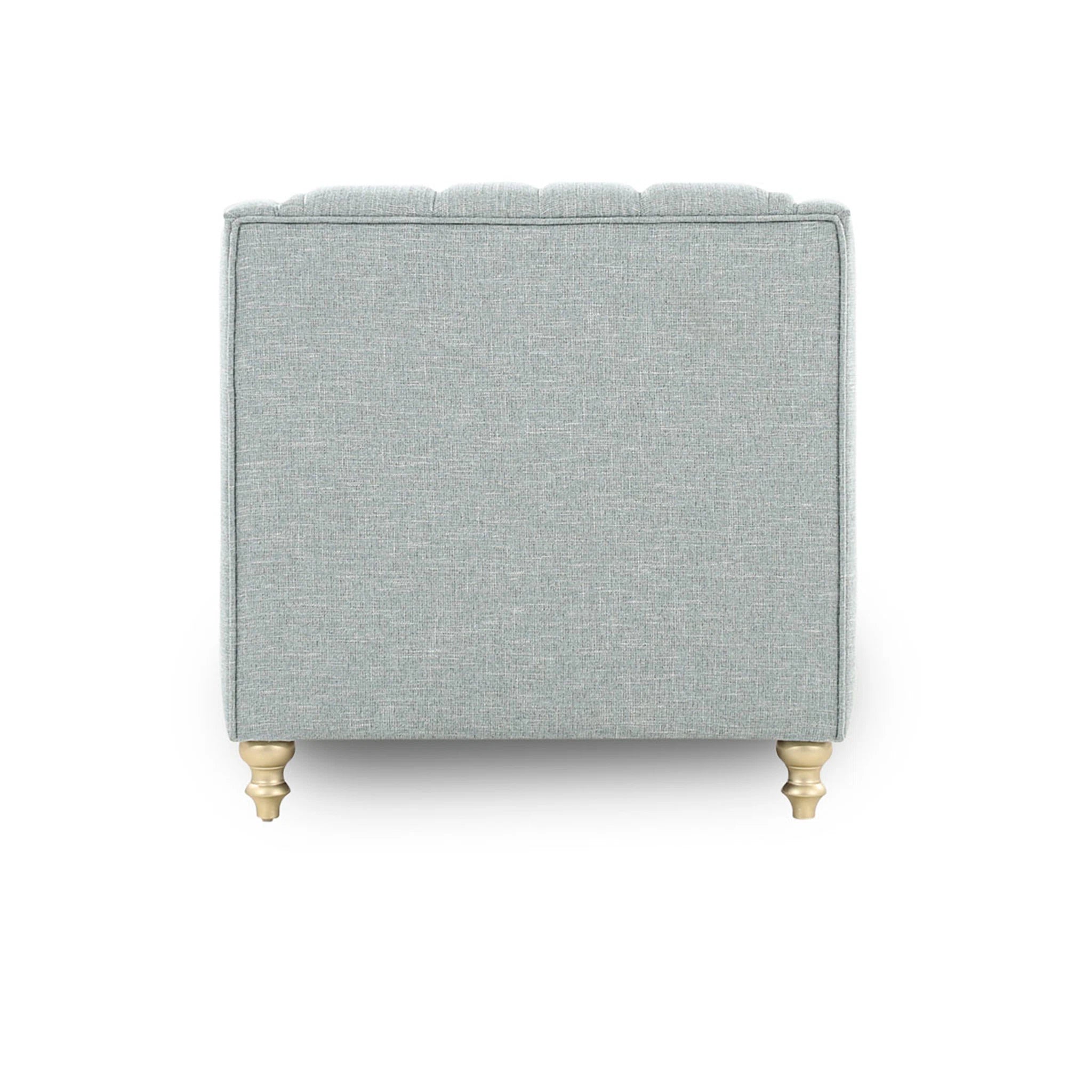 Gray upholstered ottoman with gold legs on a white background