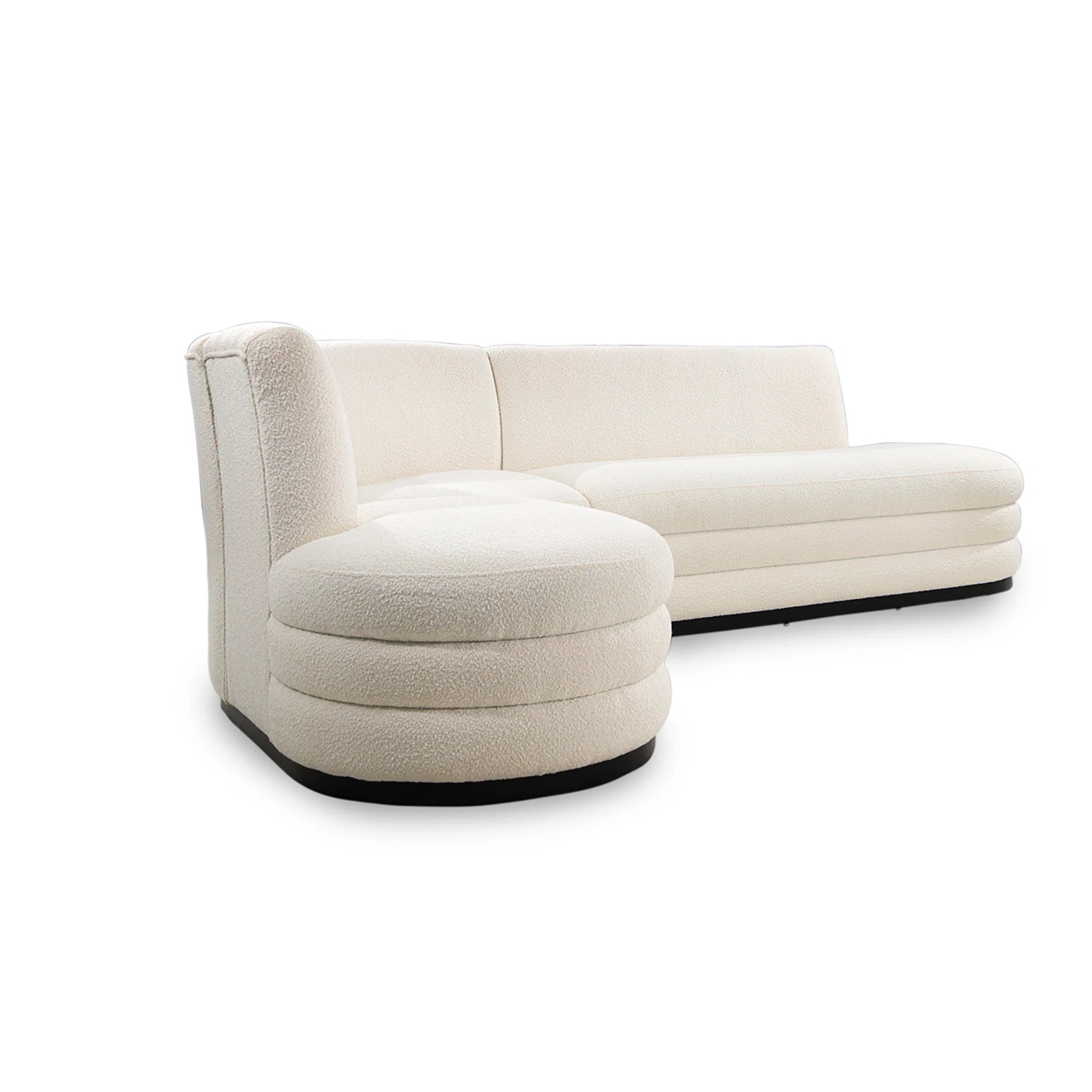 Beige sofa with matching ottoman on a white background