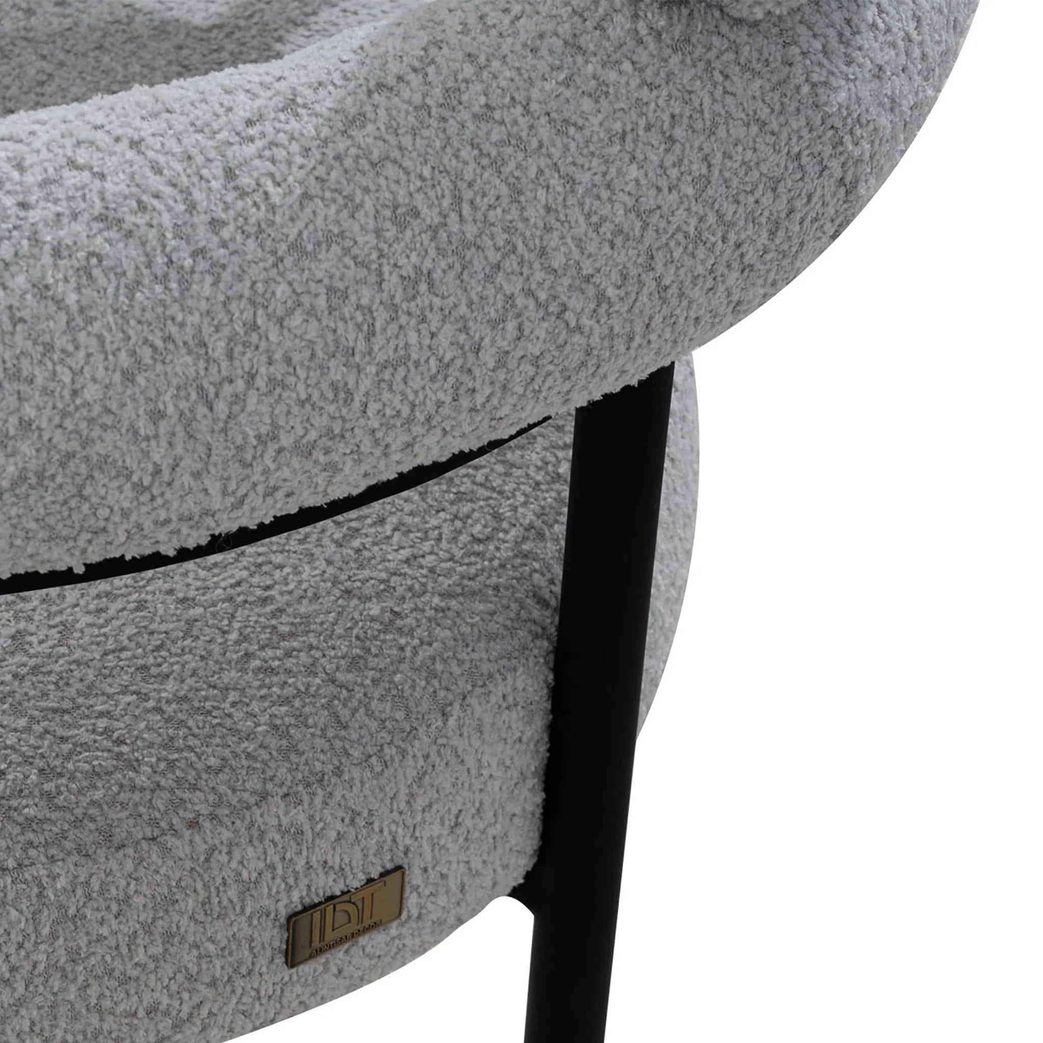 Gray textured chair with a visible brand logo on a white background