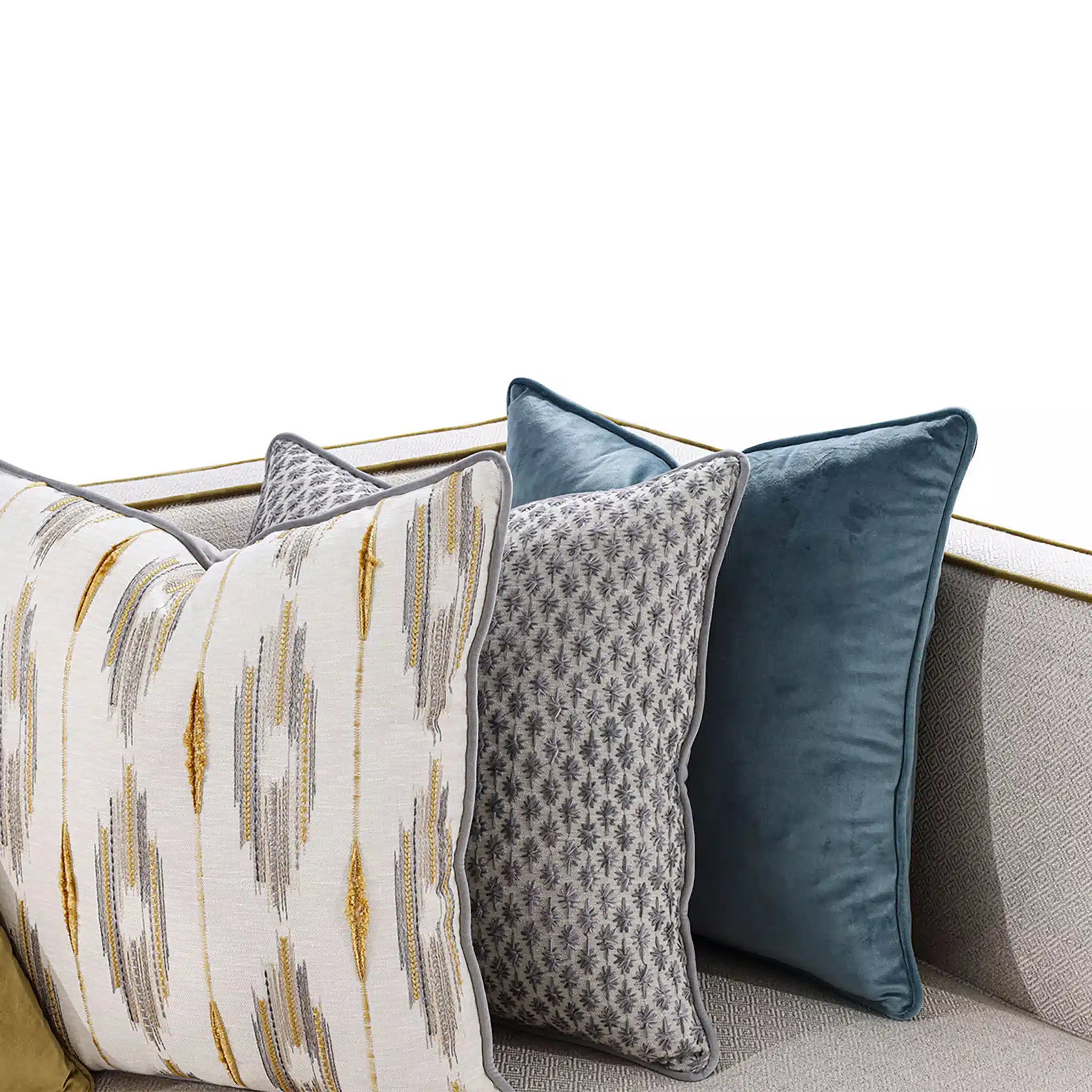 Decorative pillows with different patterns on a sofa
