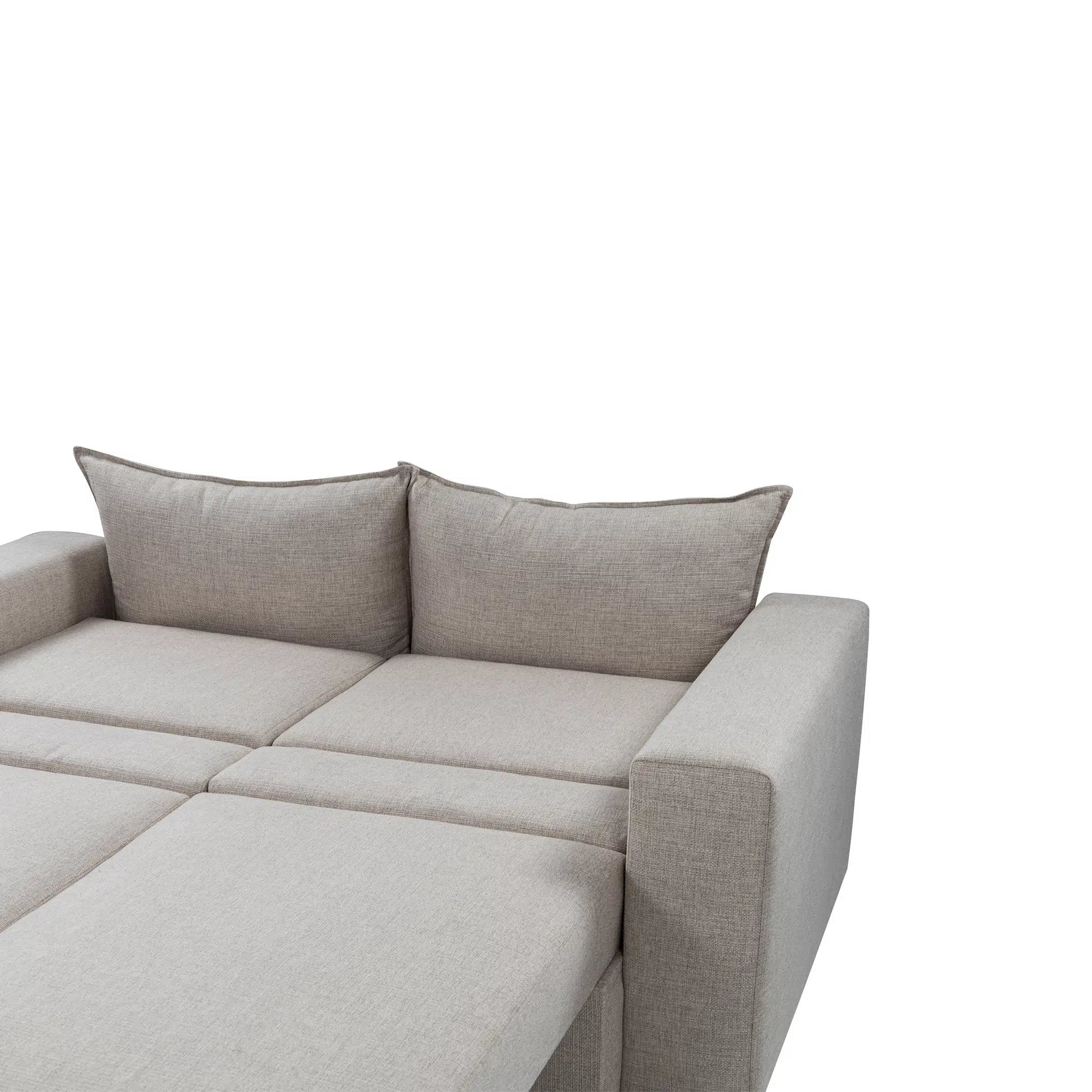 Gray sectional sofa with cushions on a white background