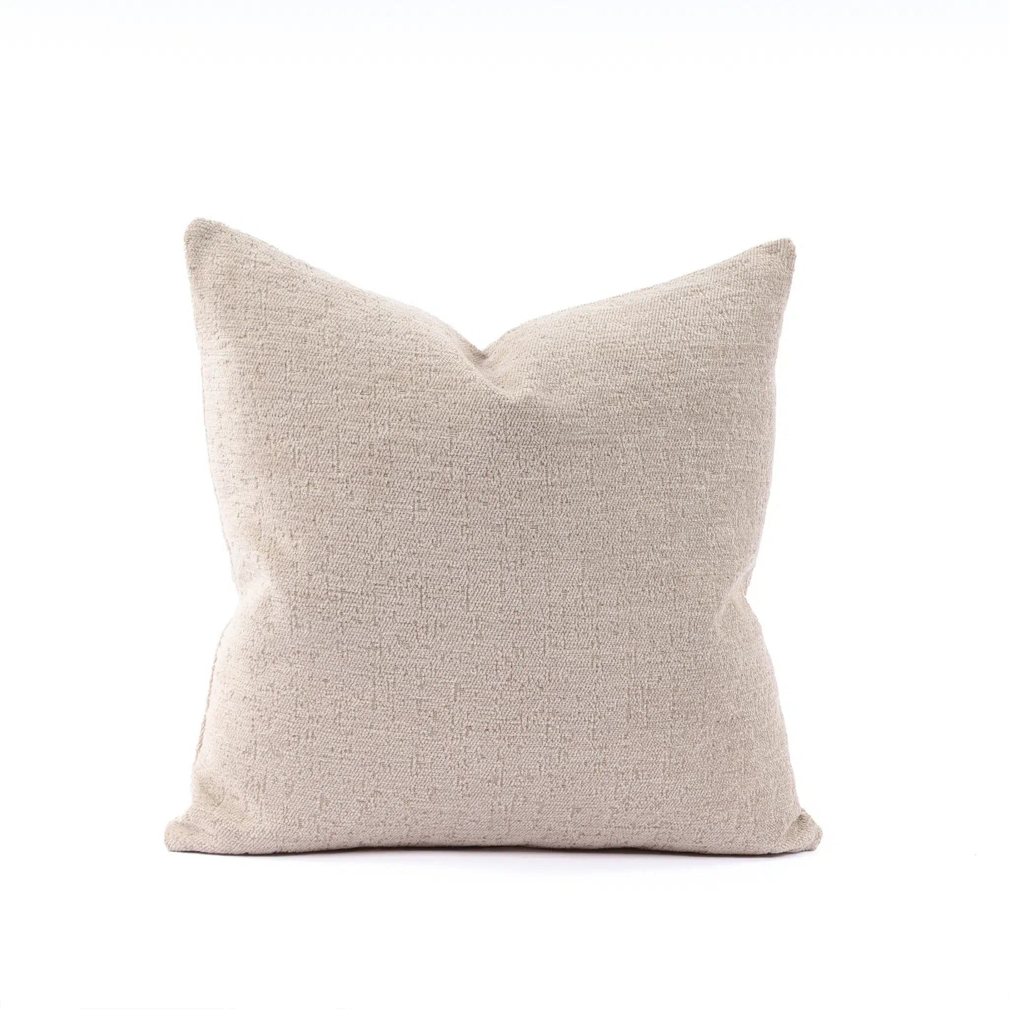 Beige pillow on a white background