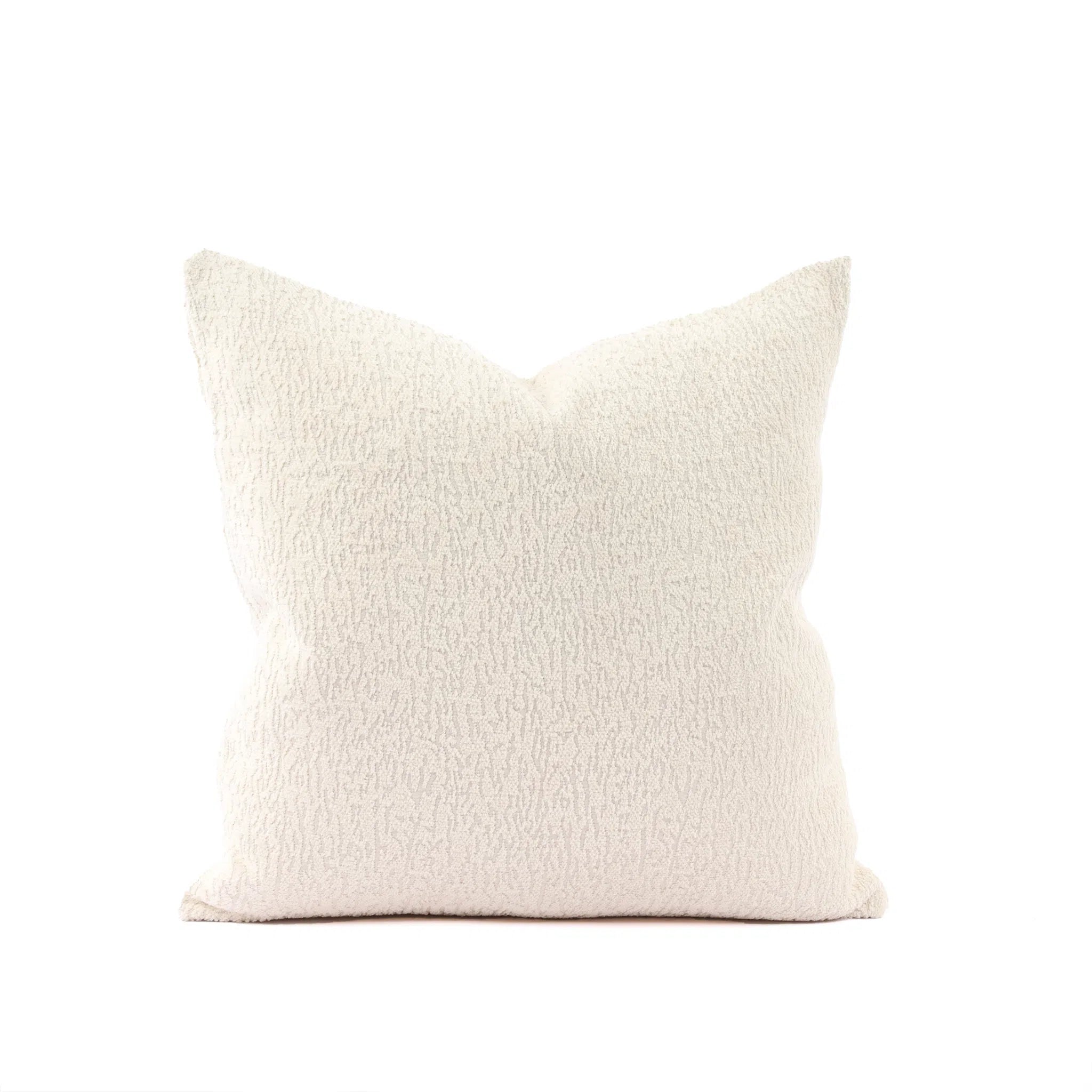 Beige textured pillow on a white background