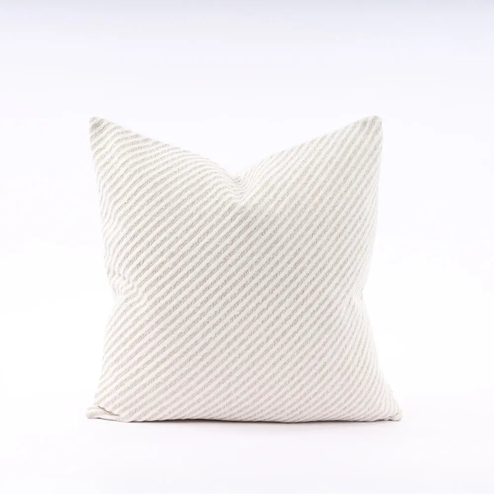 Textured white pillow on a white background