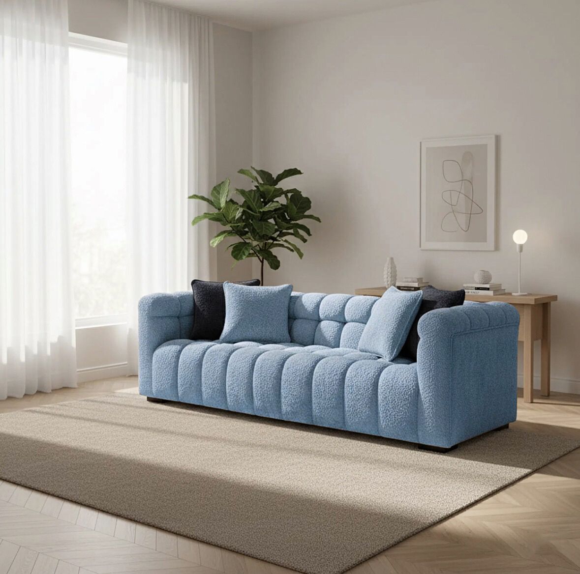 Blue sofa in a living room with a plant and decor items.