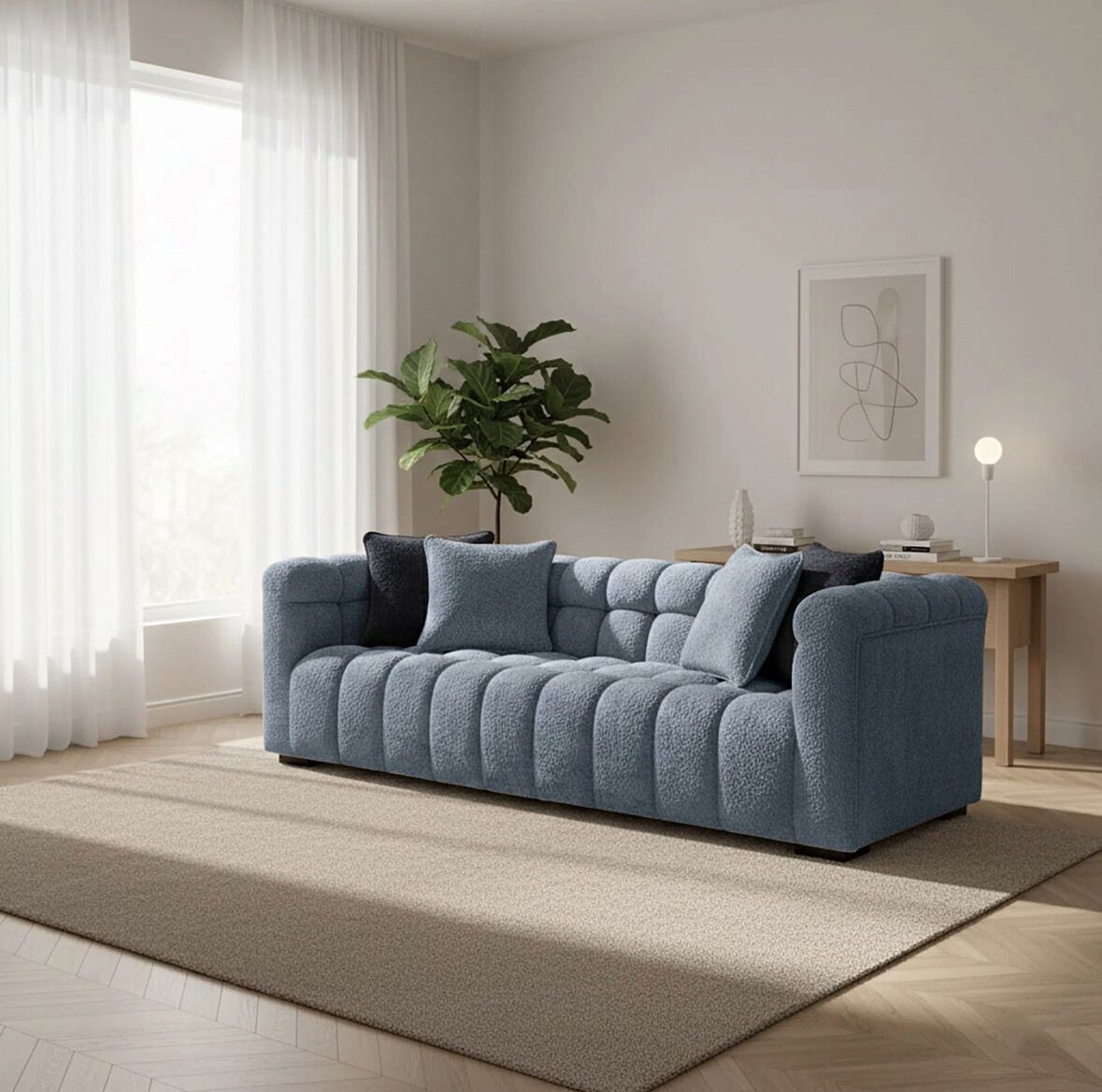 Blue sofa in a living room with a plant and decor items.