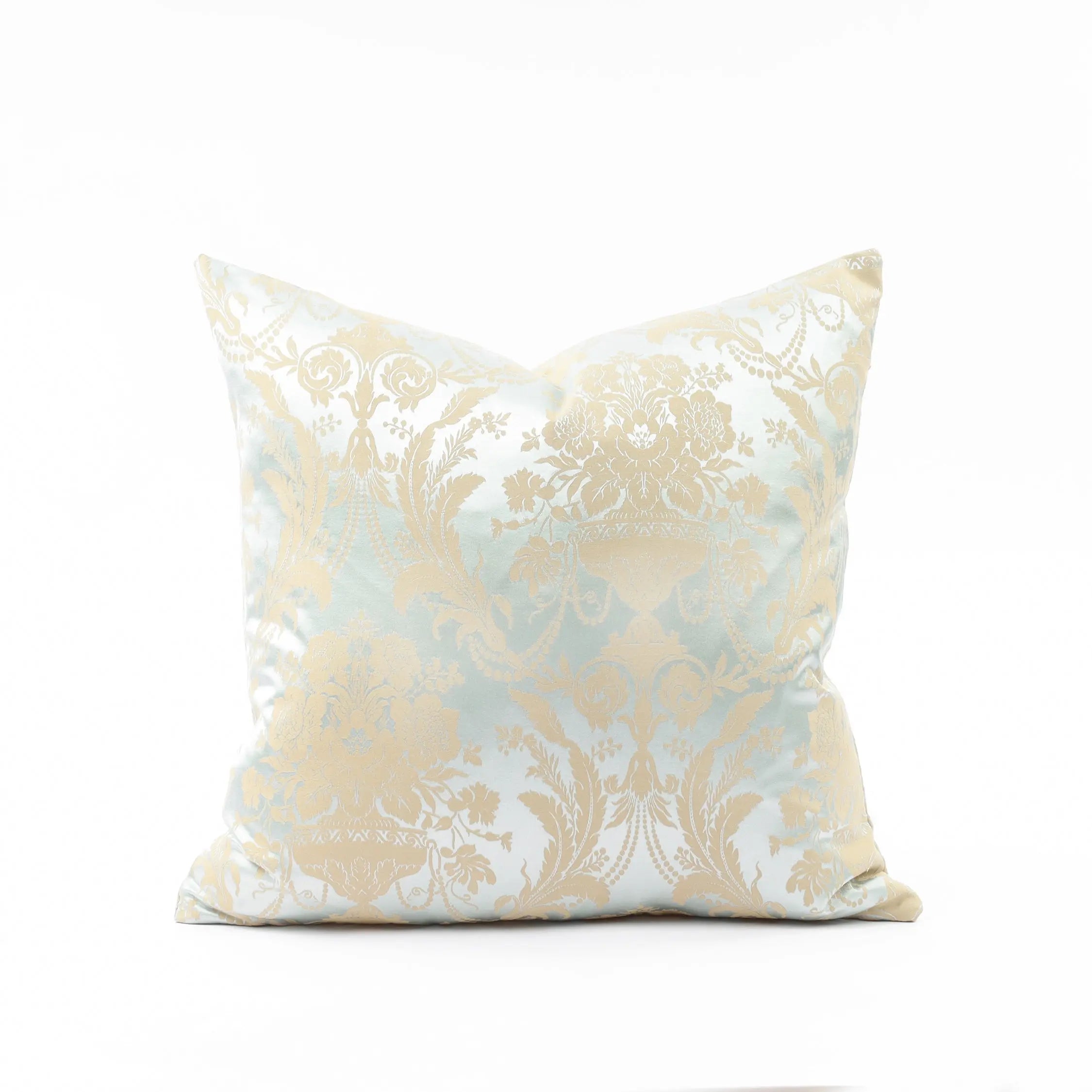 Decorative pillow with beige and white floral pattern on a white background