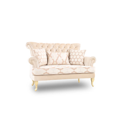 Beige patterned sofa with decorative pillows on a white background
