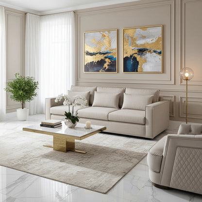 Modern living room with beige sofa, coffee table, and abstract art on the wall.