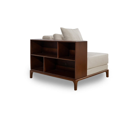 Sofa with wooden bookshelf section on a white background