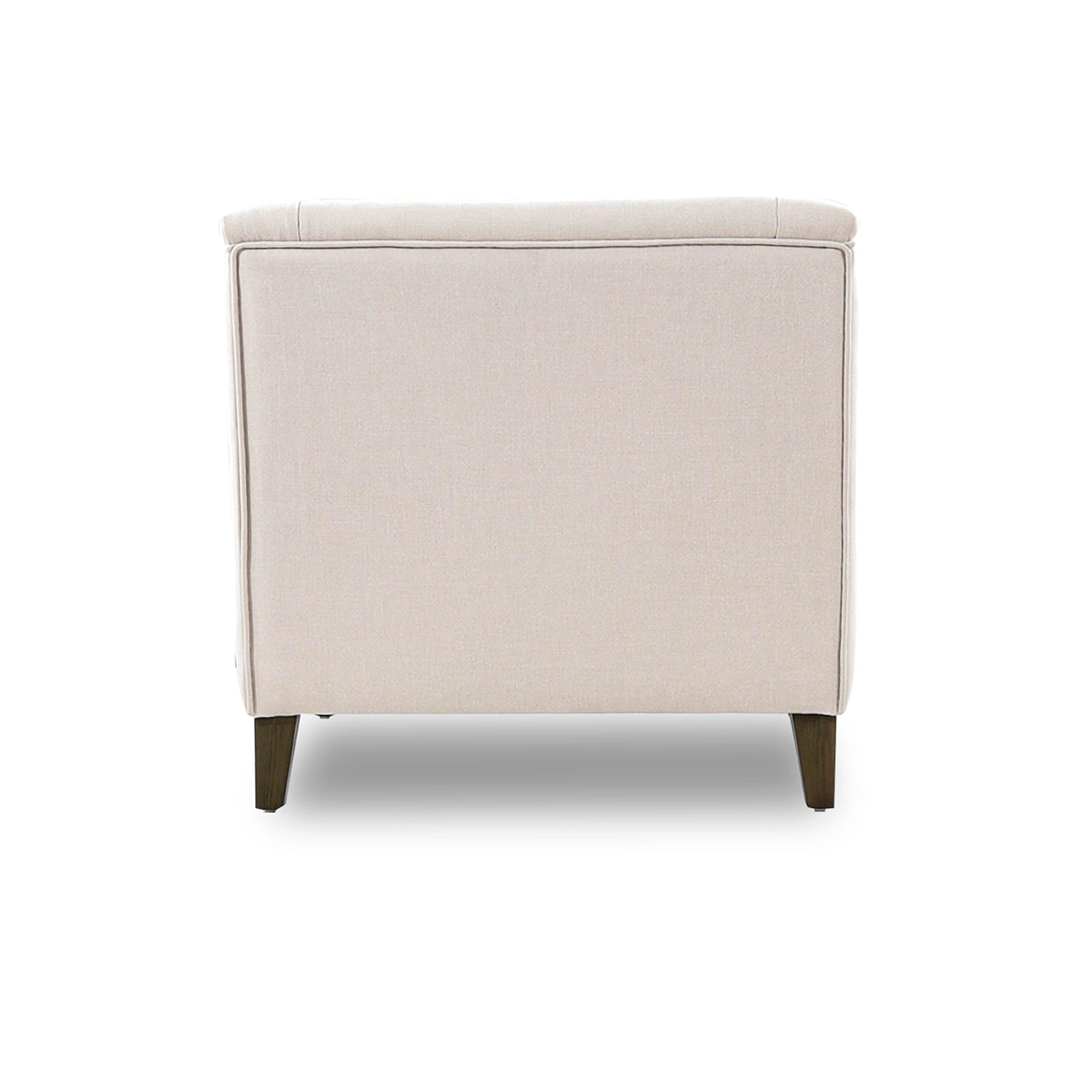 Beige upholstered ottoman on a white background