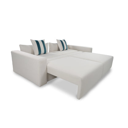 White sectional sofa with striped cushions on a white background