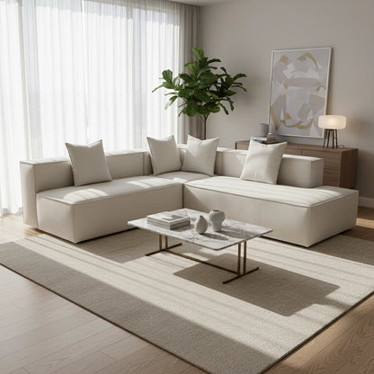 Modern living room with a beige sectional sofa, coffee table, and abstract art on the wall.