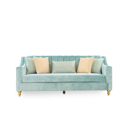 Light blue sofa with decorative pillows on a white background