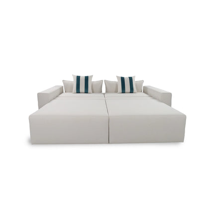 White sectional sofa with striped cushions on a white background