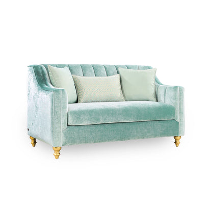 Light blue sofa with gold legs on a white background
