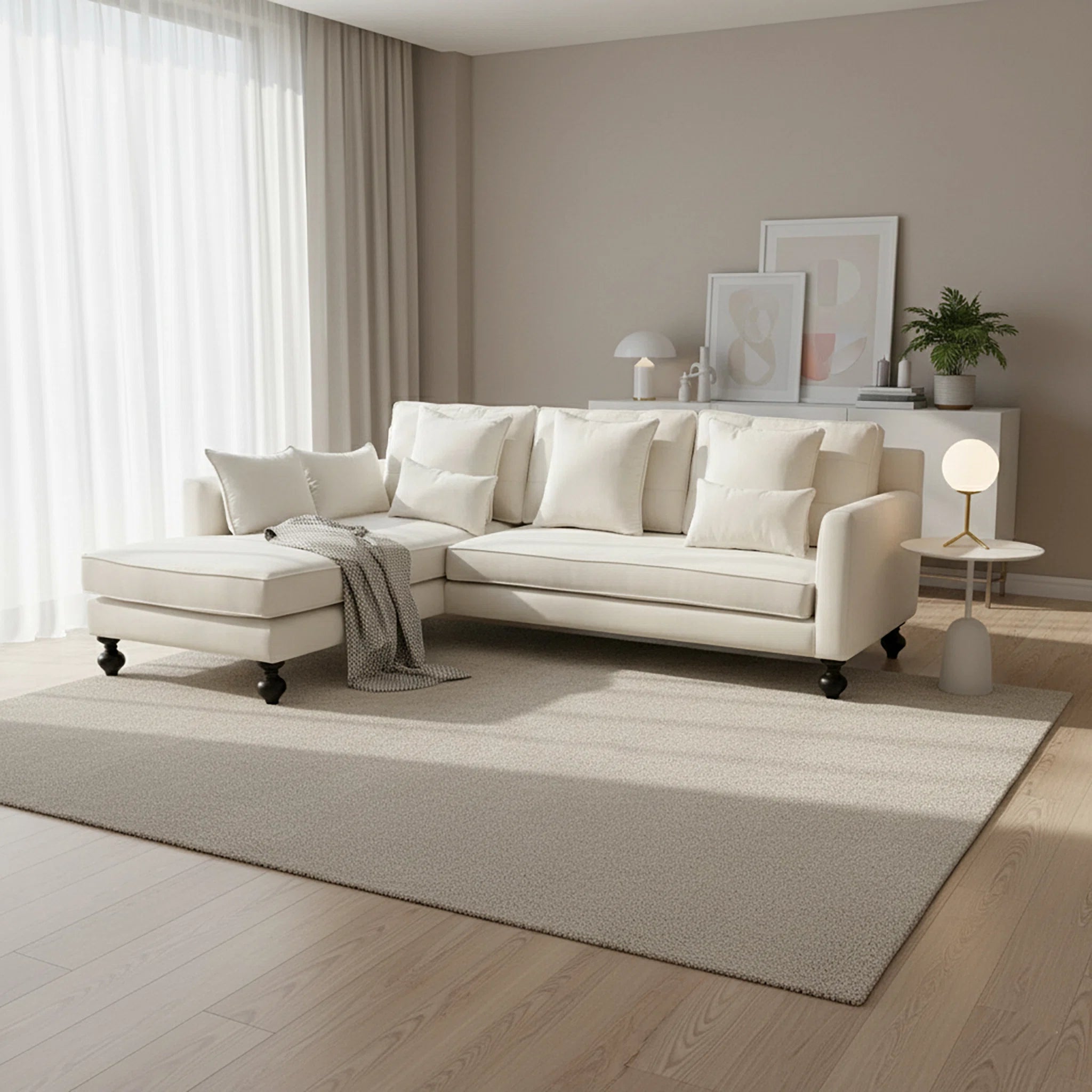 White sectional sofa in a modern living room with neutral decor.