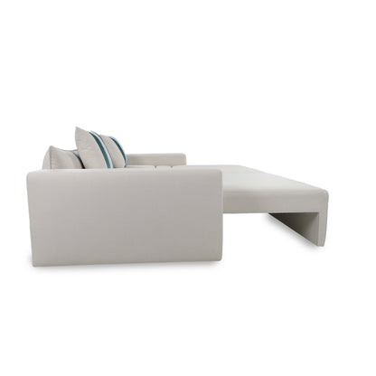 Gray sectional sofa with a striped pillow on a white background