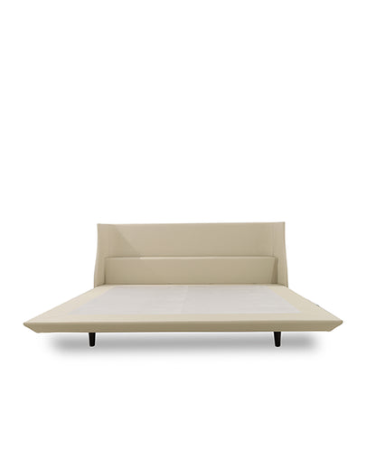 Beige bed with a white mattress on a white background