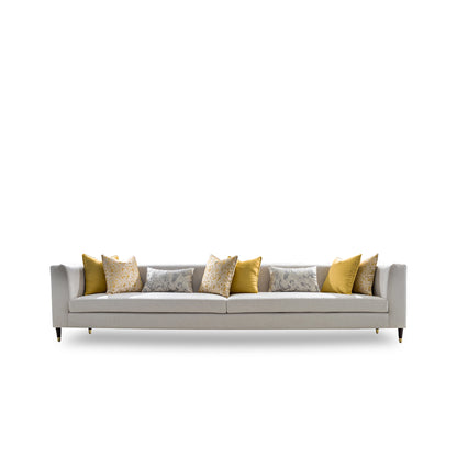 Gray sofa with patterned cushions on a white background