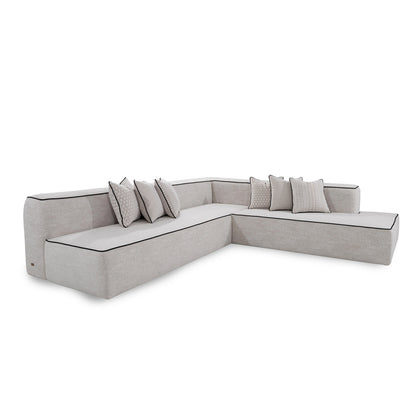 Gray sectional sofa with cushions on a white background