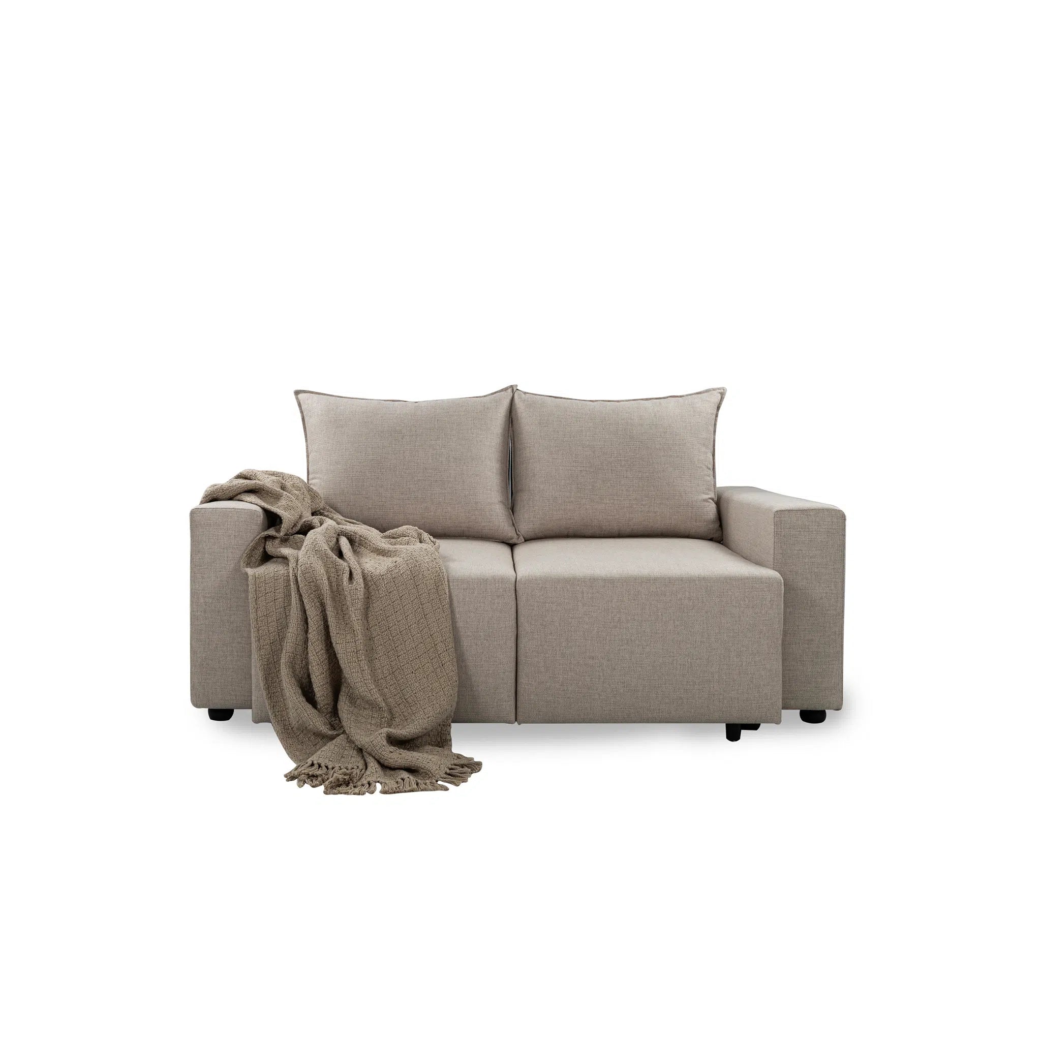 Beige sofa with a blanket on a white background