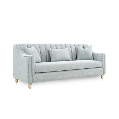 Light gray sofa with gold legs on a white background