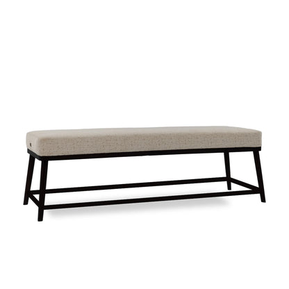 Beige upholstered bench with black metal frame on a white background