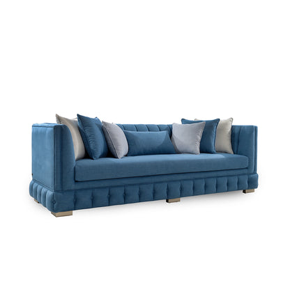 Blue sofa with decorative pillows on a white background