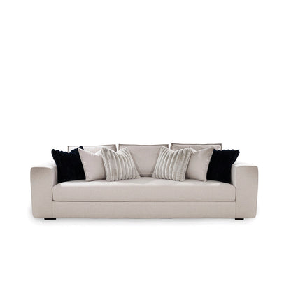 Beige sofa with decorative pillows on a white background