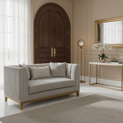 Gray sofa in a stylish living room with a wooden door and decorative elements.