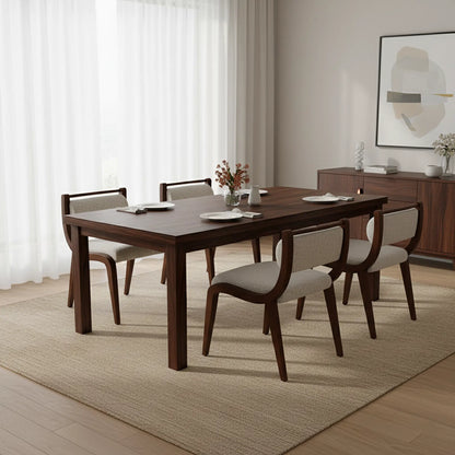 Dining room with wooden table and chairs in a well-lit room.