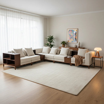 Modern living room with a sectional sofa, coffee table, and decorative elements.