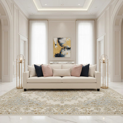 Living room with a beige sofa, decorative pillows, and abstract art on the wall.