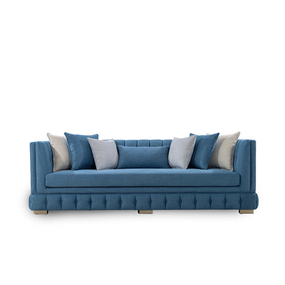 Blue sofa with decorative cushions on a white background