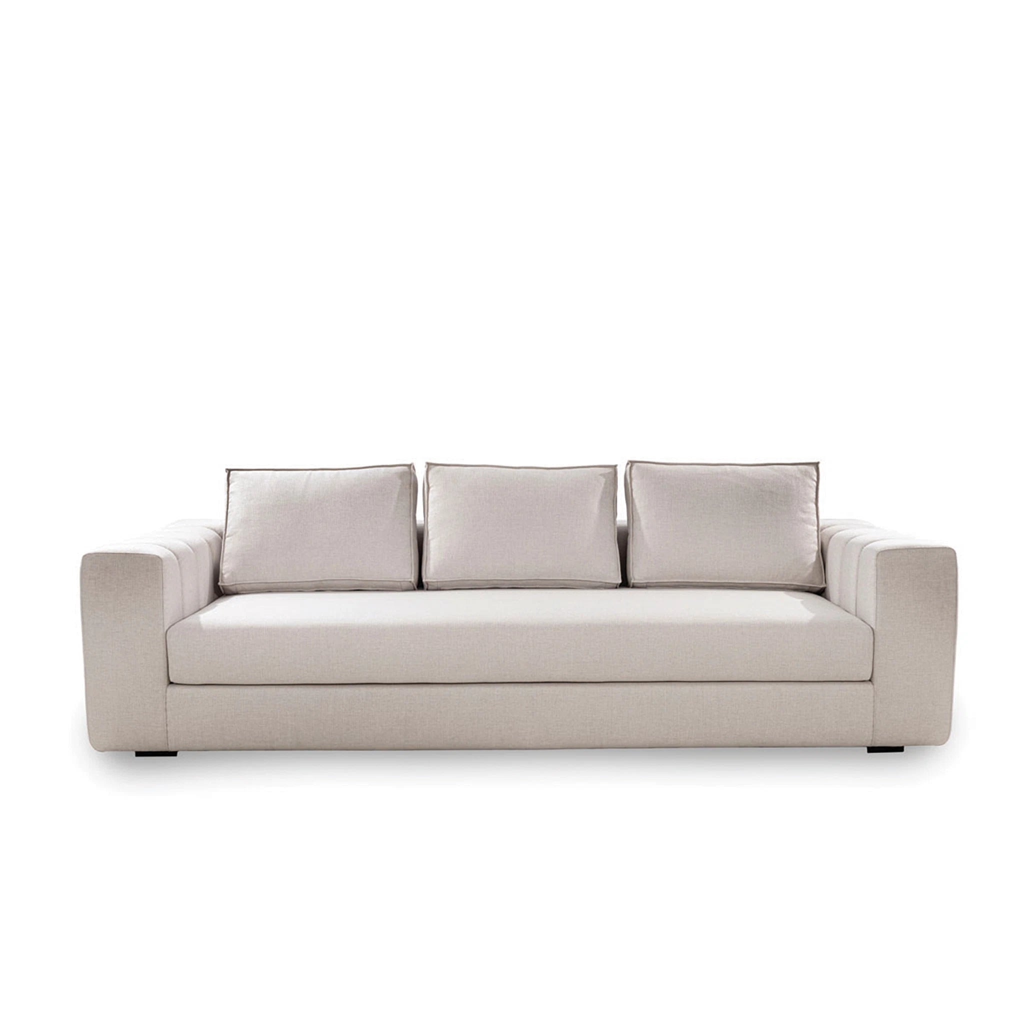 Beige sofa with three cushions on a white background