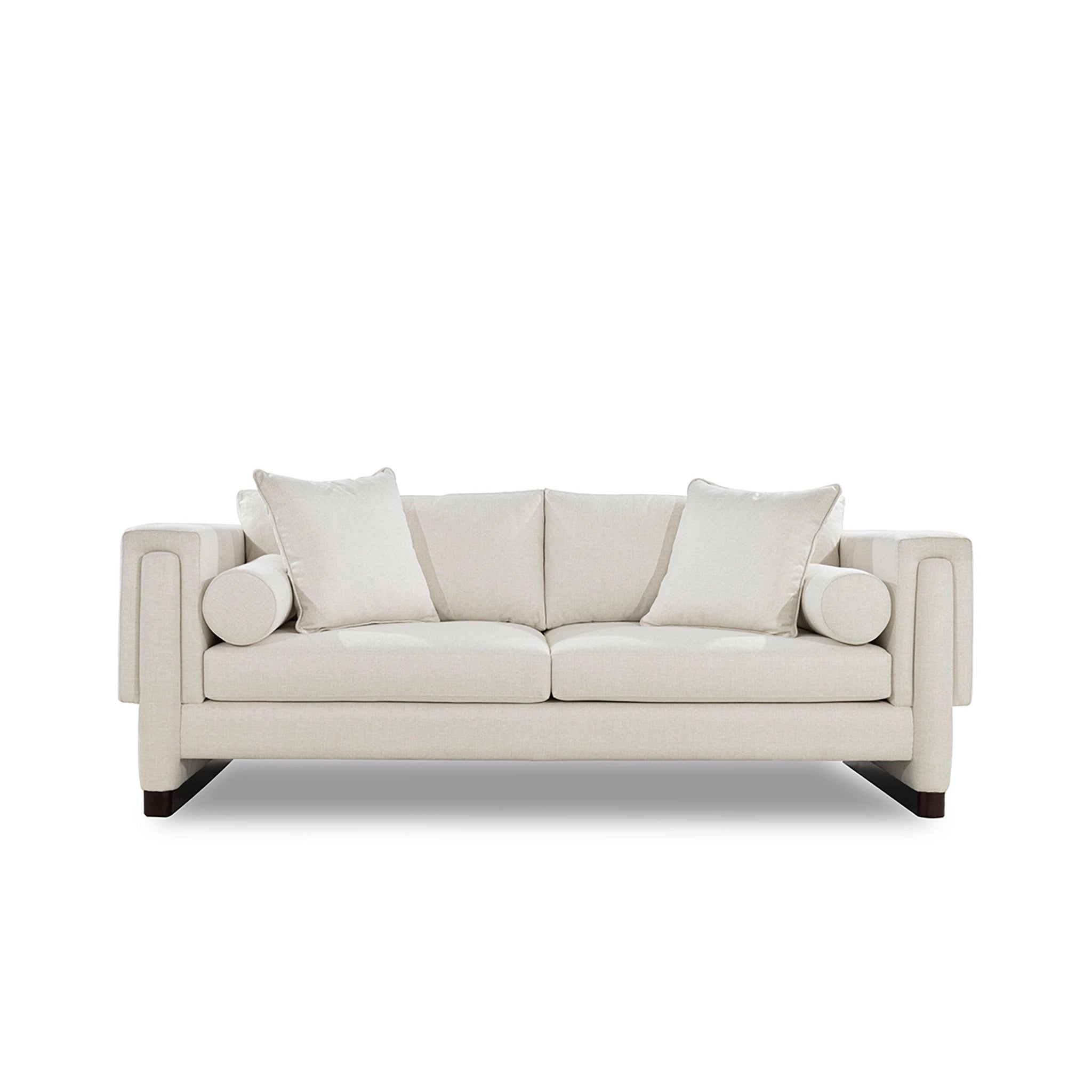 Beige sofa with two cushions on a white background