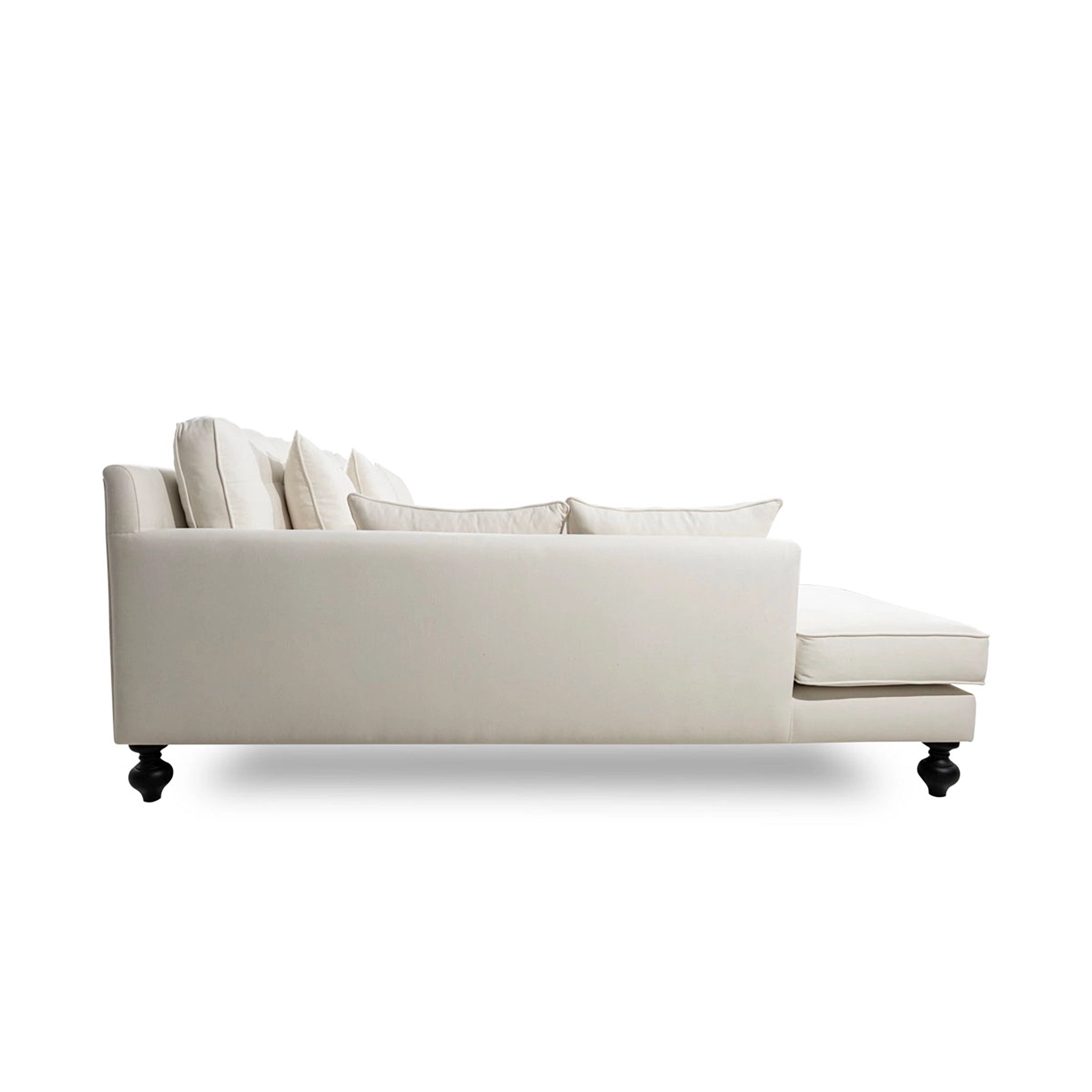 Beige sectional sofa with cushions on a white background