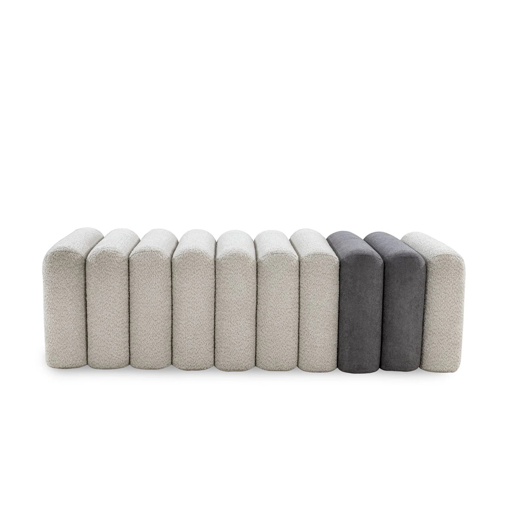 Row of gray and beige rectangular cushions on a white background
