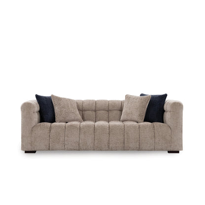 Beige sofa with dark cushions on a white background