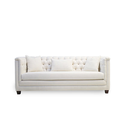 White tufted sofa on a white background