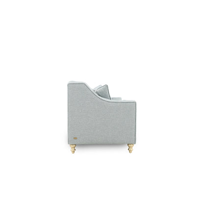 Gray upholstered chair with gold legs on a white background