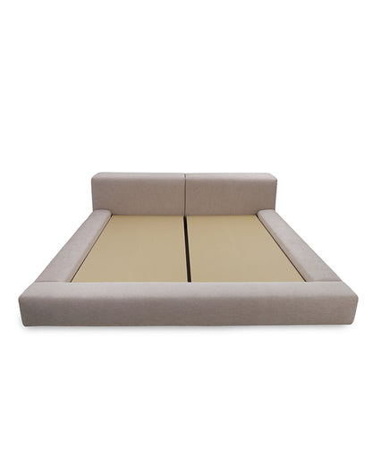 Beige bed frame with beige mattress on a white background