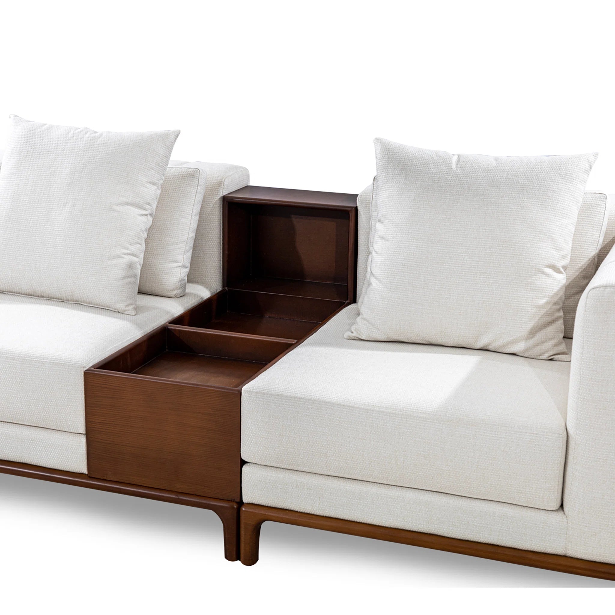 White sofa with wooden side table and storage compartments on a white background