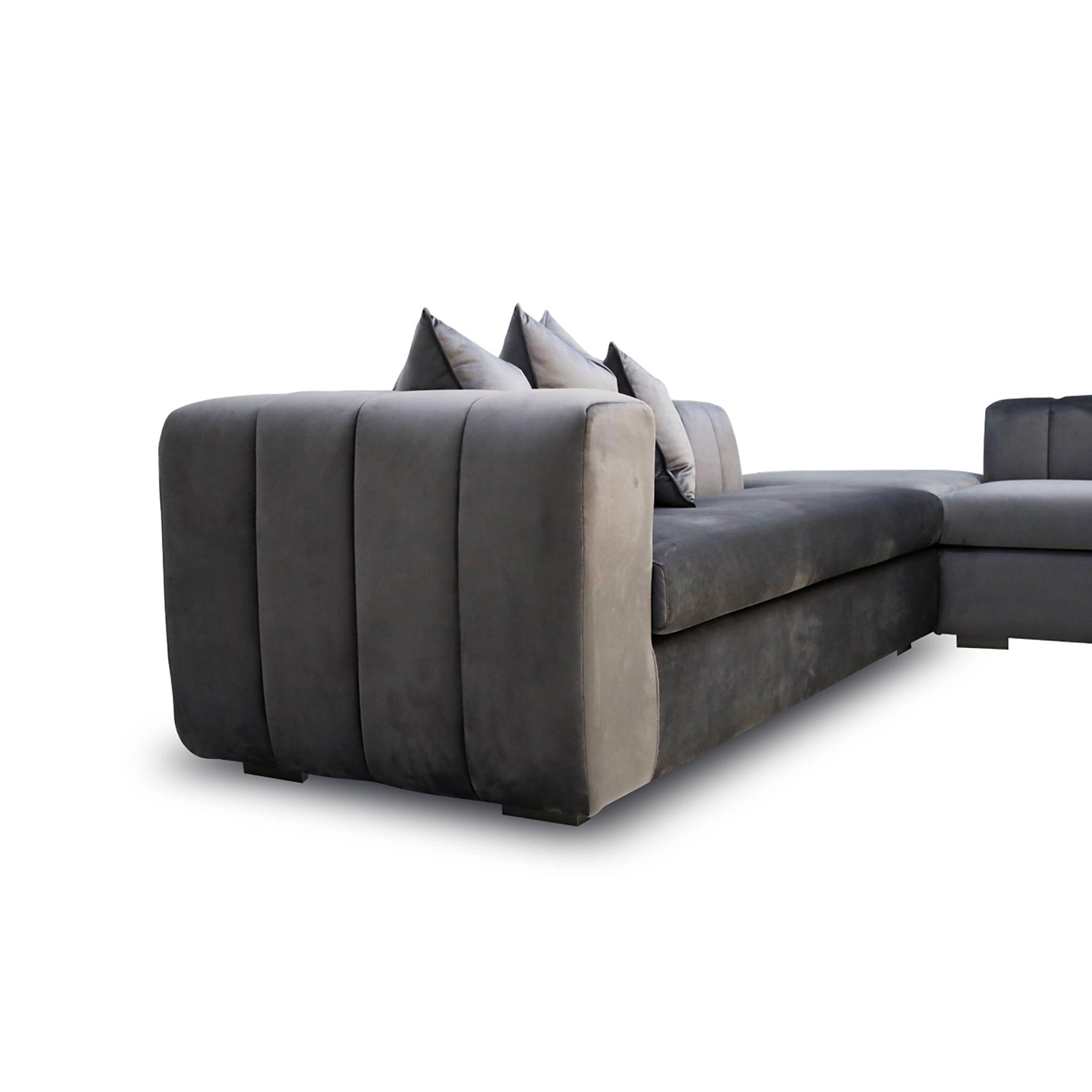 Gray sectional sofa with cushions on a white background