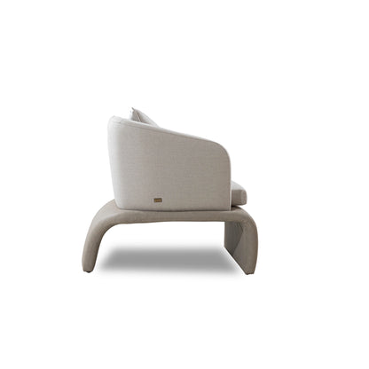 Modern beige armchair on a white background