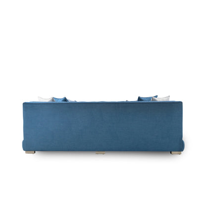 Blue sofa with cushions on a white background